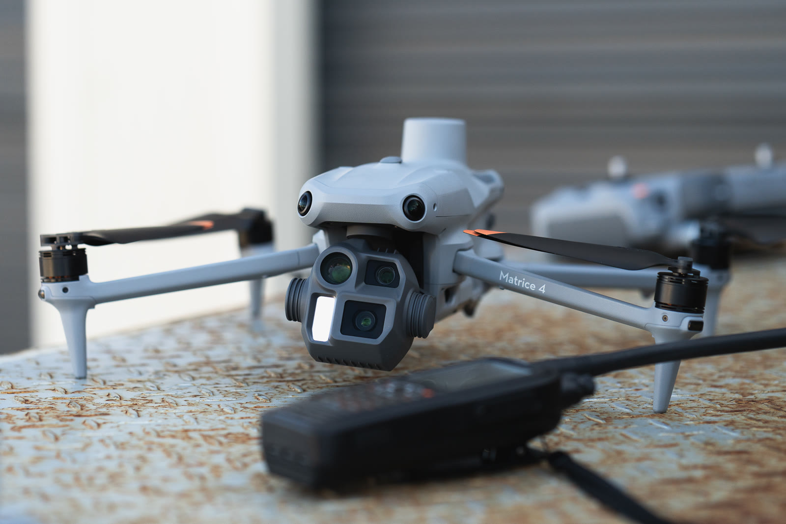 A DJI Matrice 4 Enterprise drone on a steel bench
