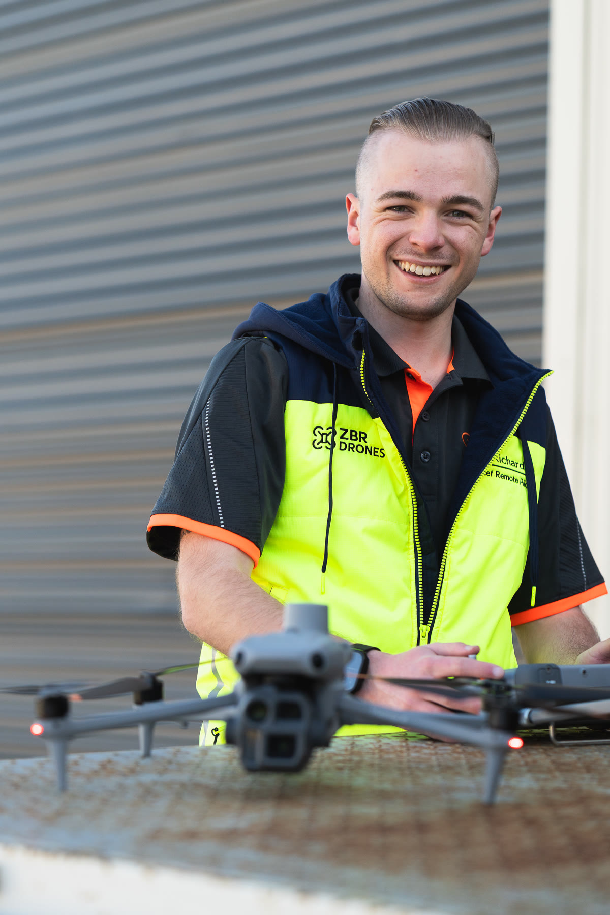 Zak Richardson in a ZBR Drones hi-vis vest with the Matrice 4 drone